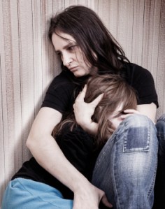 A mother protecting her daughter.