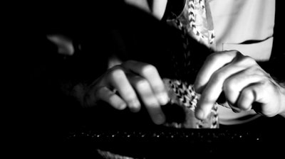 stock-footage-light-focuses-on-the-hands-of-a-man-typing-on-a-vintage-s-style-manual-typewriter-film-noir