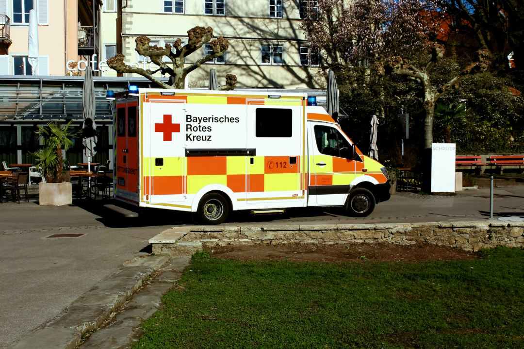 ambulance truck parked near building